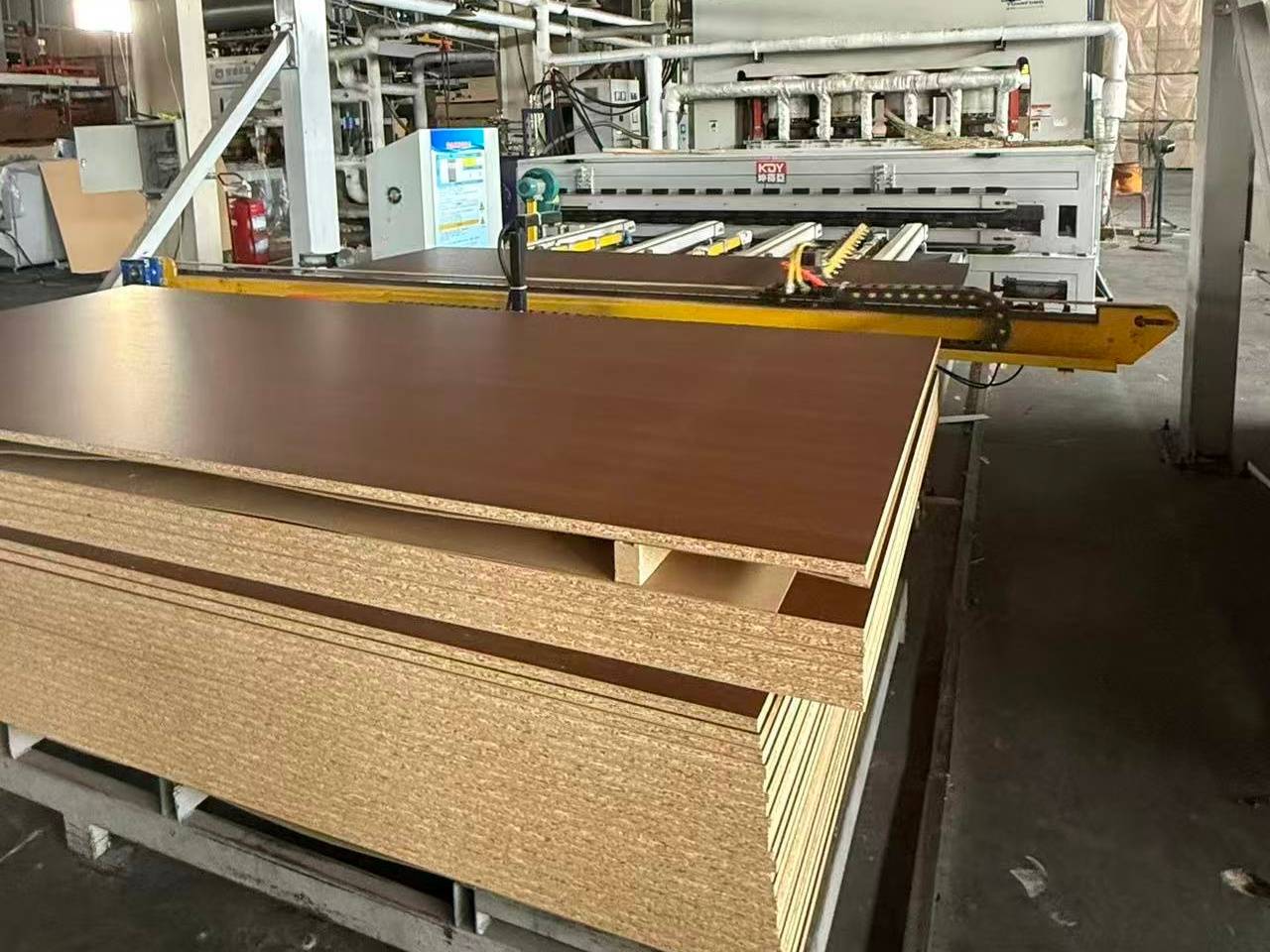 Advanced particle board production and cutting line — Chinese factories upgrade technology to meet global standards.